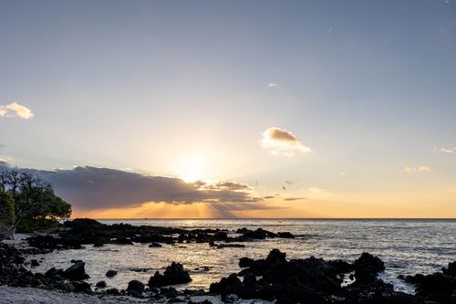 The sunset over the beach in Hawaii